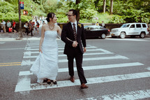 bride and groom on a cross walk 