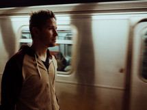 man walking in a subway 