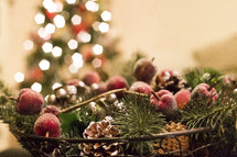lights on a Christmas tree and bowl of garland 