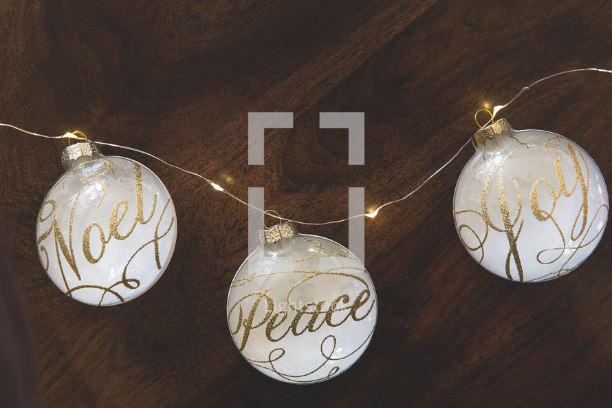 peace, noel, and joy Christmas ornaments