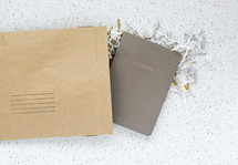 envelope with a notebook inside, thoughts 