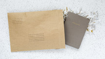 envelope with a notebook inside, thoughts 