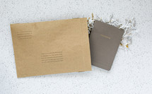 envelope with a notebook inside - thoughts 