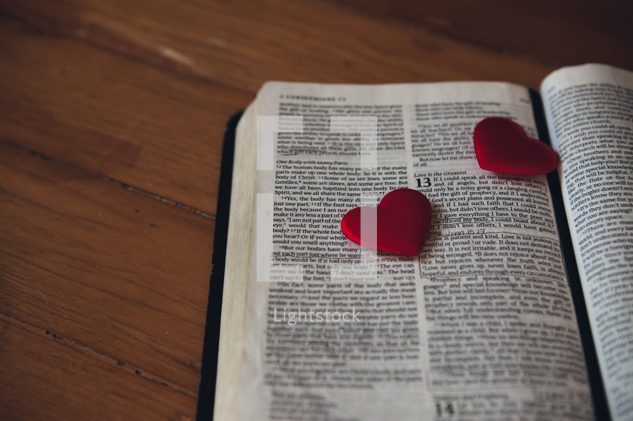 Candy hearts on the pages of a Bible. 