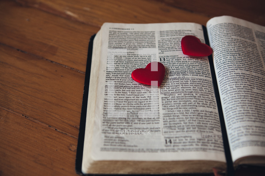 Candy hearts on the pages of a Bible
