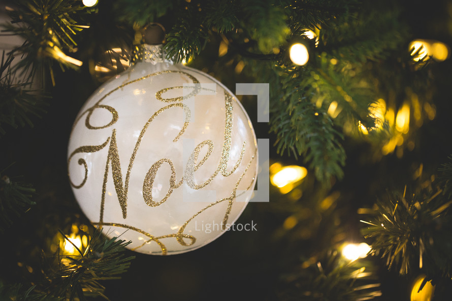 noel Christmas ornament on a Christmas tree