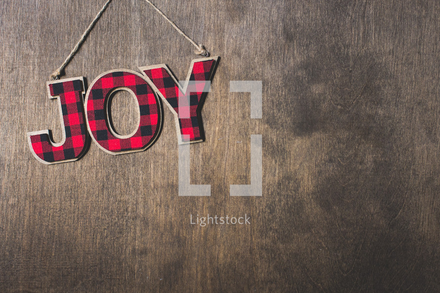 joy sign on wood 