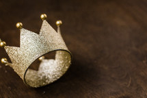 gold crown on a wood background 
