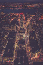 looking down at city lights at night 