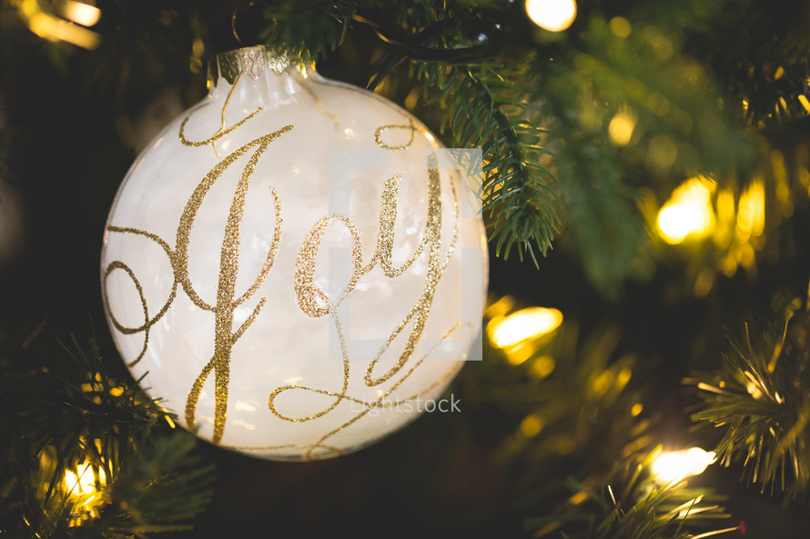 Joy ornament on a Christmas tree 