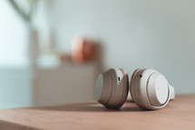 headphones on a wood table 