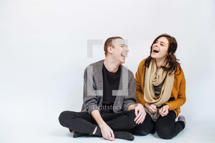man and a woman laughing 