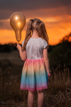 girl holding a balloon 