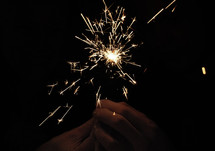 holding sparklers 