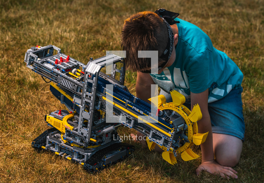 a boy building a machine 