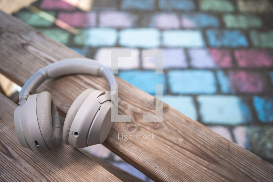 headphones on a bench 