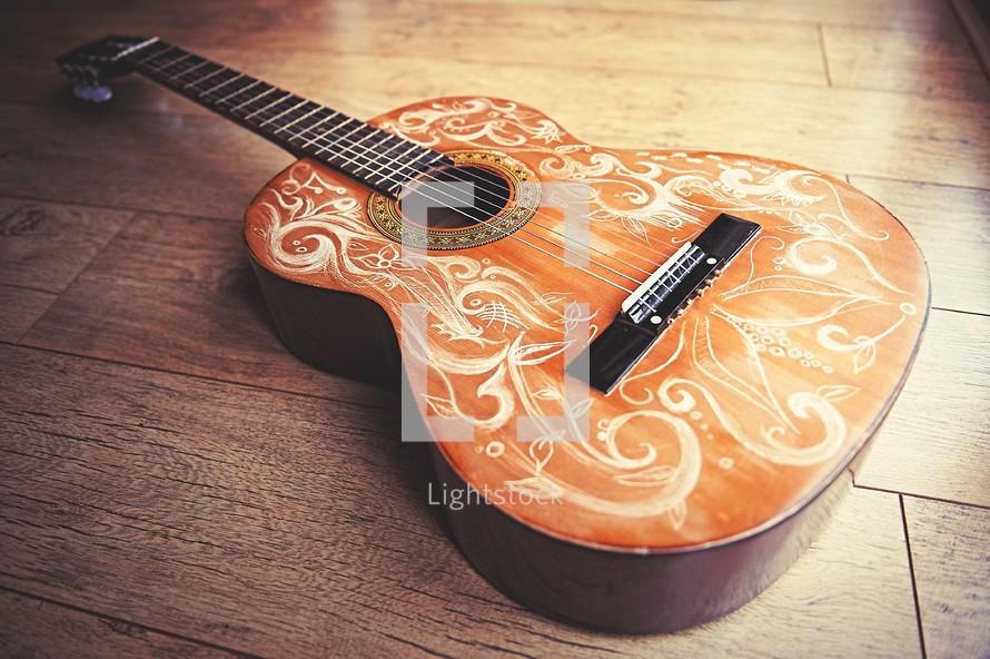 detailed scrolls on an acoustic guitar 