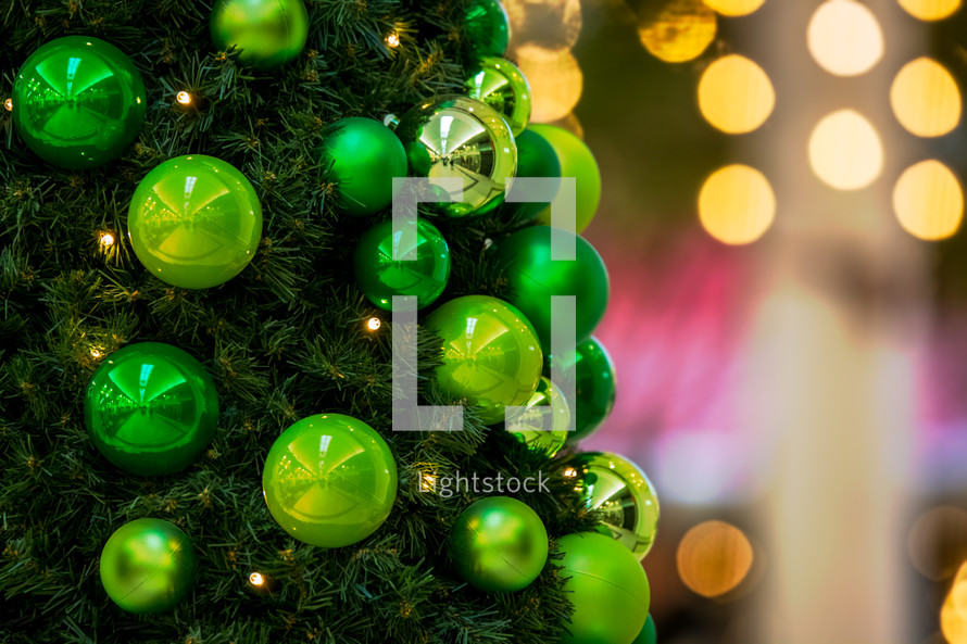 lime green ornaments on a Christmas tree 
