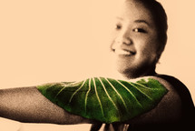 leaf on the arm of a woman