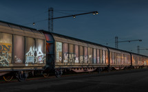 grafiti on train cars at night 