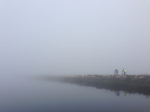 riding bicycles in dense fog 