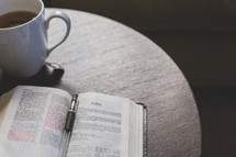 Coffee cup, Bible, reading glasses 