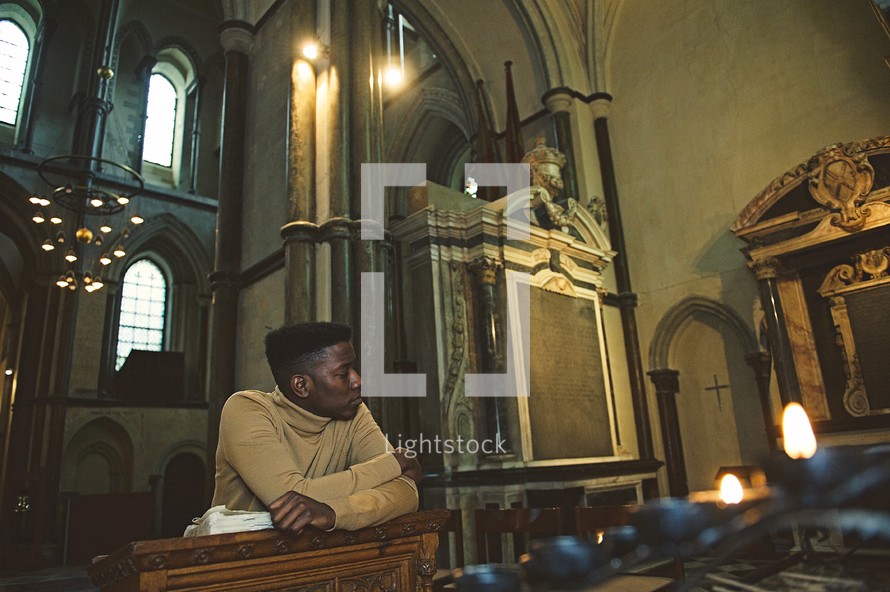 man at the pulpit in an empty church 