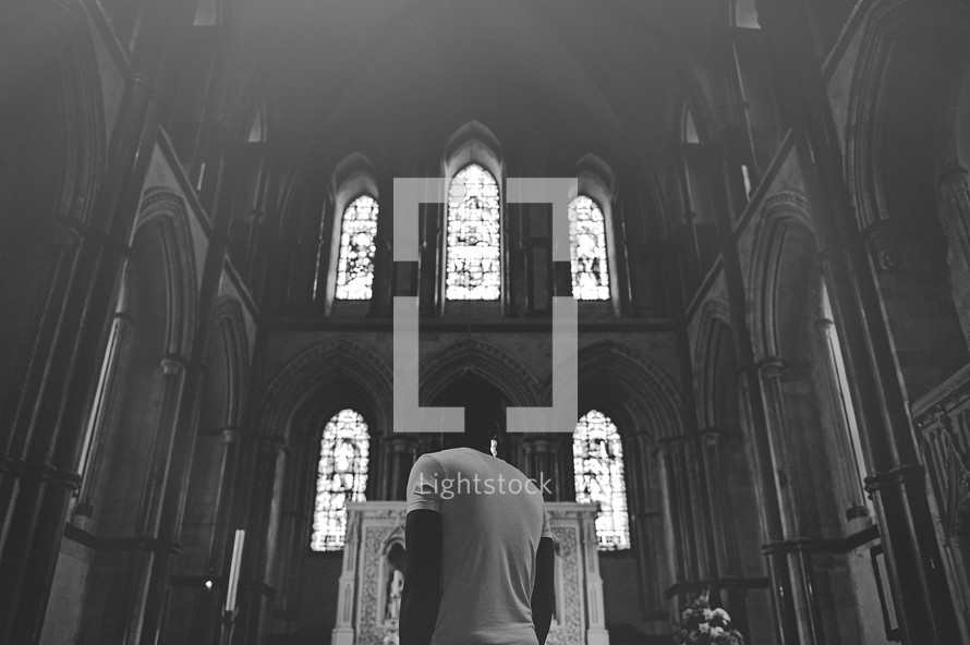 man approaching an altar 