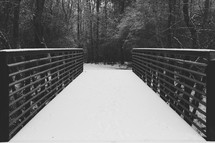 snow on a walking bridge 