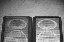 speakers on a floor 