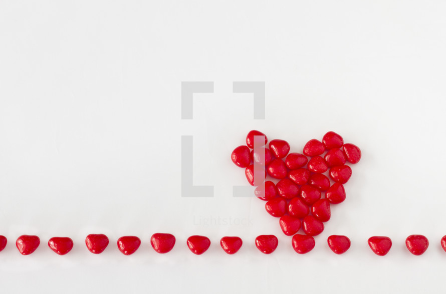 heart candy in a heart shape pile