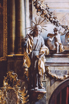 statue of Jesus and cherub 