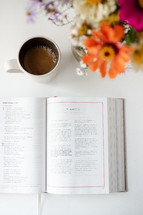 coffee and an opened Bible study book 