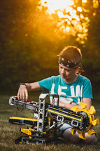 a boy building a robot 