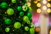 lime green ornaments on a Christmas tree 