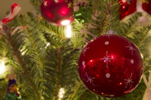 red Christmas ornament bulbs on a tree