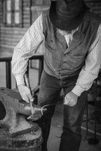 ironsmith shaping metal 