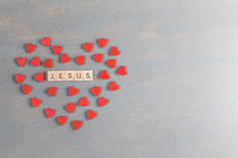 red hearts around the word Jesus 