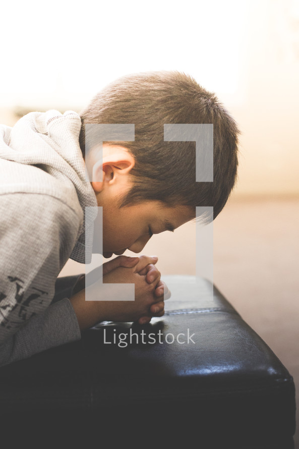 A boy in prayer 