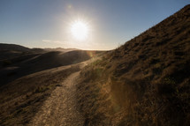 sunlight over a mountain path 
