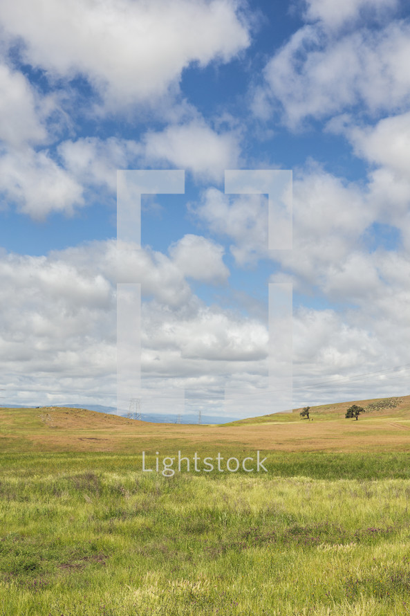 Clouds over a pasture.