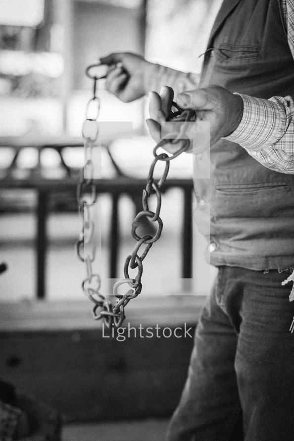 man holding a chain 