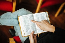 woman reading a Bible in her lap