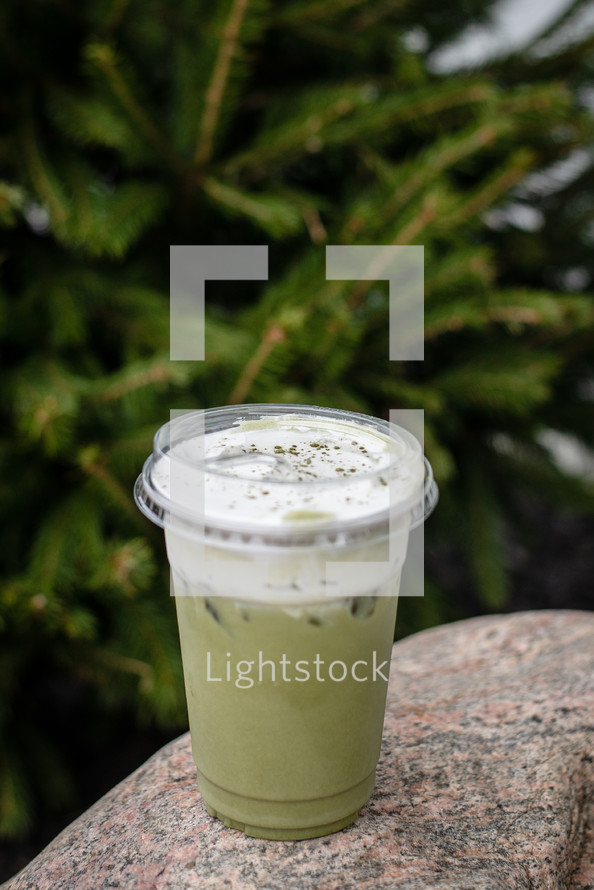 Green tea or Matcha iced beverage with foam