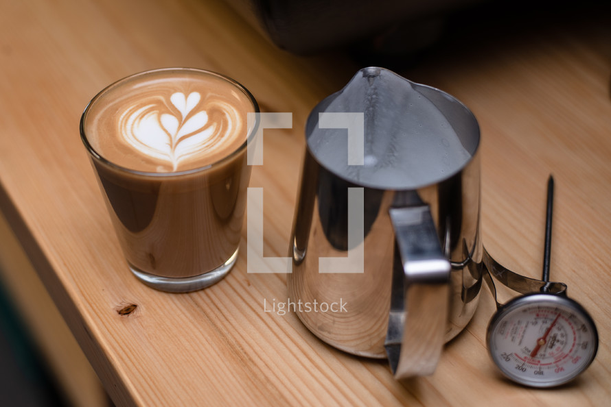 Latte coffee with fancy foam heart