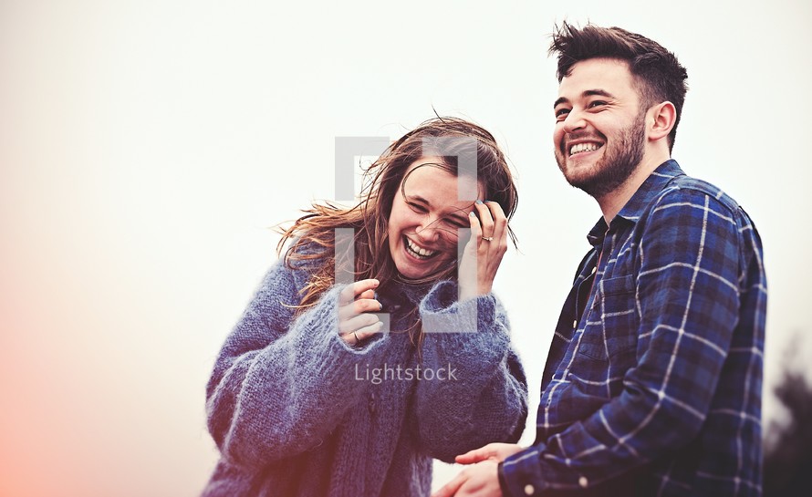 A happy, laughing man and woman.