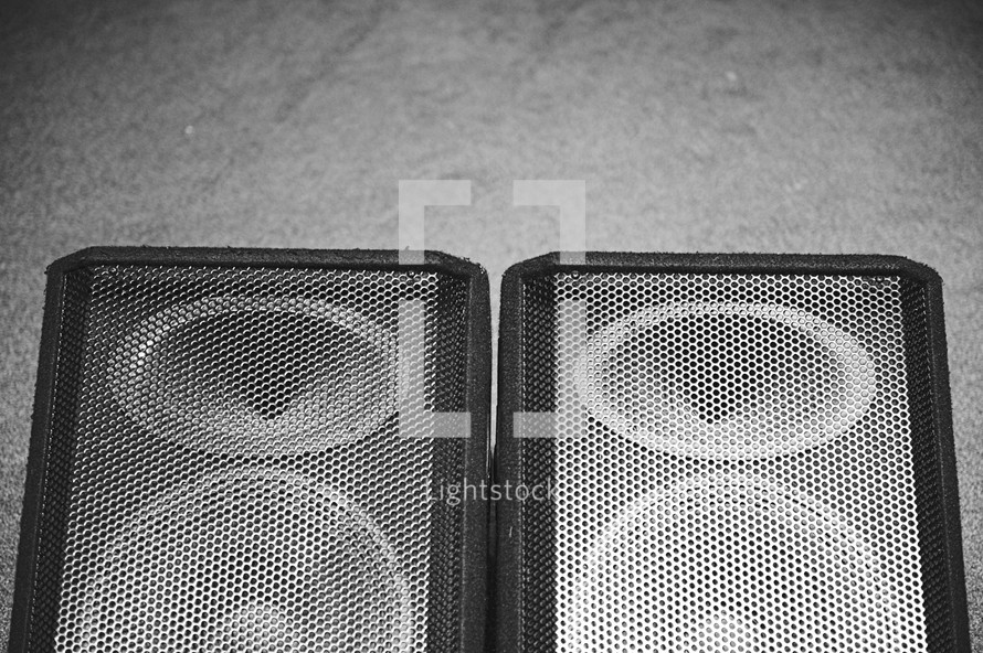 speakers on a floor 