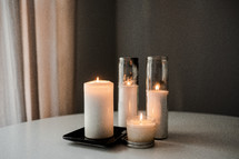 candles on a white table 