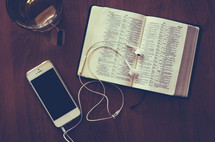 iphone, ear buds, Bible, tea mug 