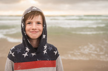 a kid standing on a beach 